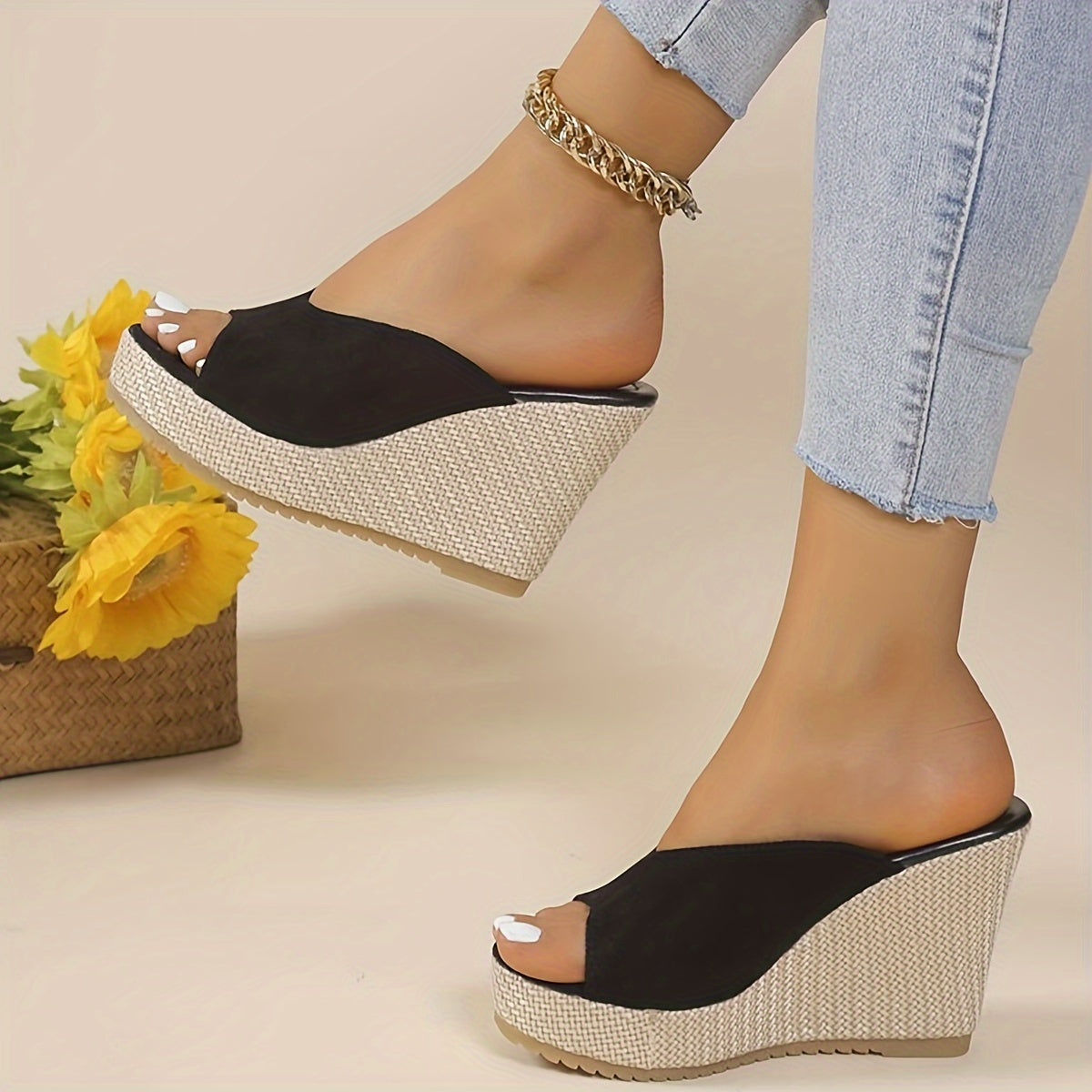 Black slip-on wedge sandals for women with an open toe, high heel, comfortable ankle strap, and woven design sole - perfect for casual summer wear.