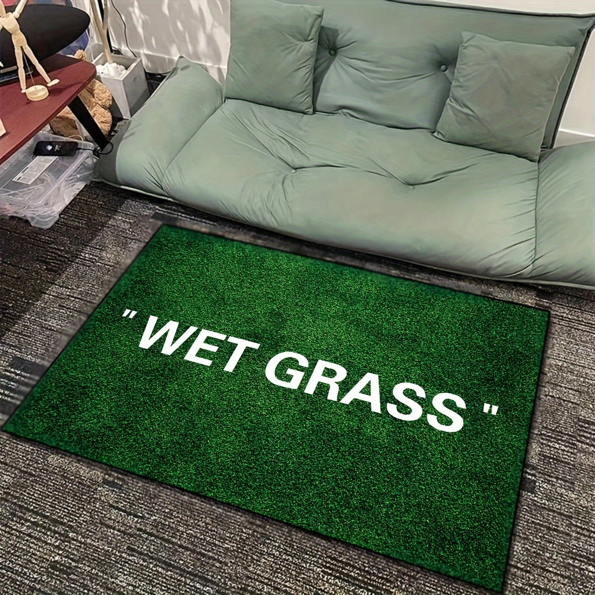 Soft, non-slip area rug featuring a chic green grass and English letter design. Machine washable for easy care, this rug is perfect for any room in your home including the living room, bedroom, kitchen, and more. Add a touch of style to your space with