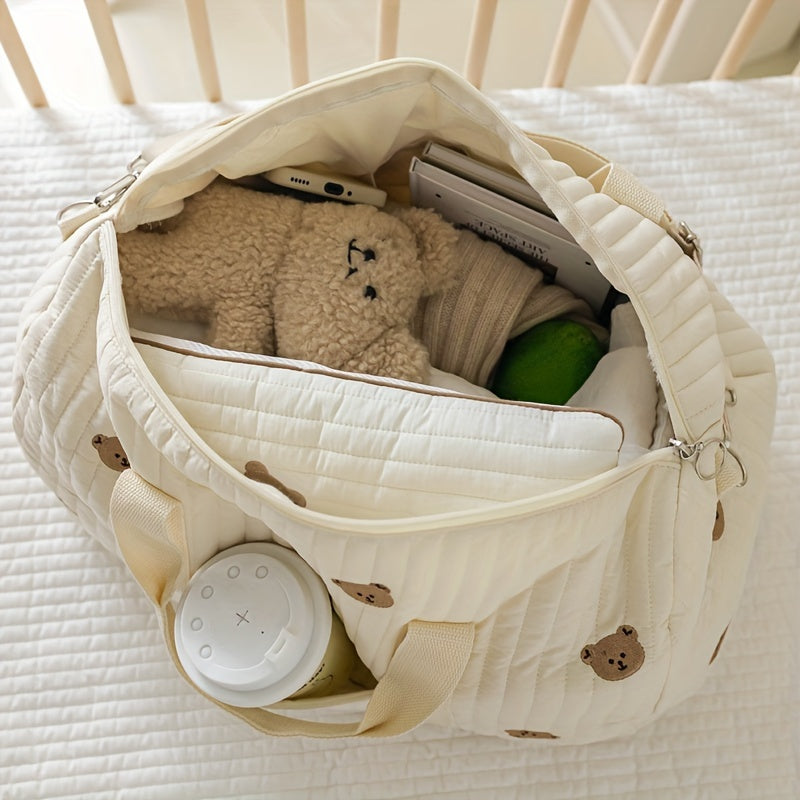 Large-capacity storage bag with embroidered bear design, ideal for carrying belongings when going out.