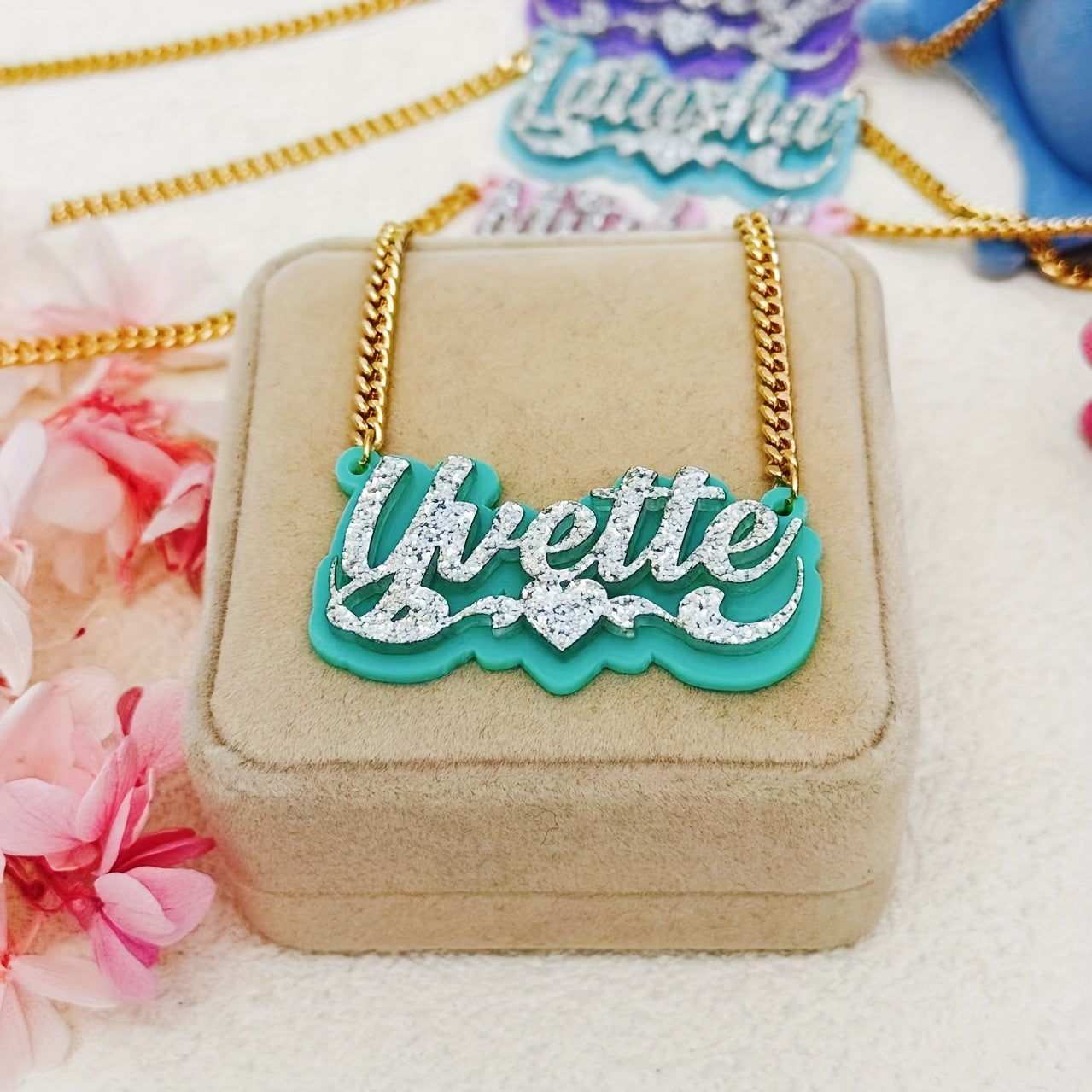 Personalize your style with a custom sparkling acrylic name necklace, adorned with a heart-shaped lace and personalized English nameplate. Available in a variety of colors, this classic piece is perfect for women looking to add a unique touch to their