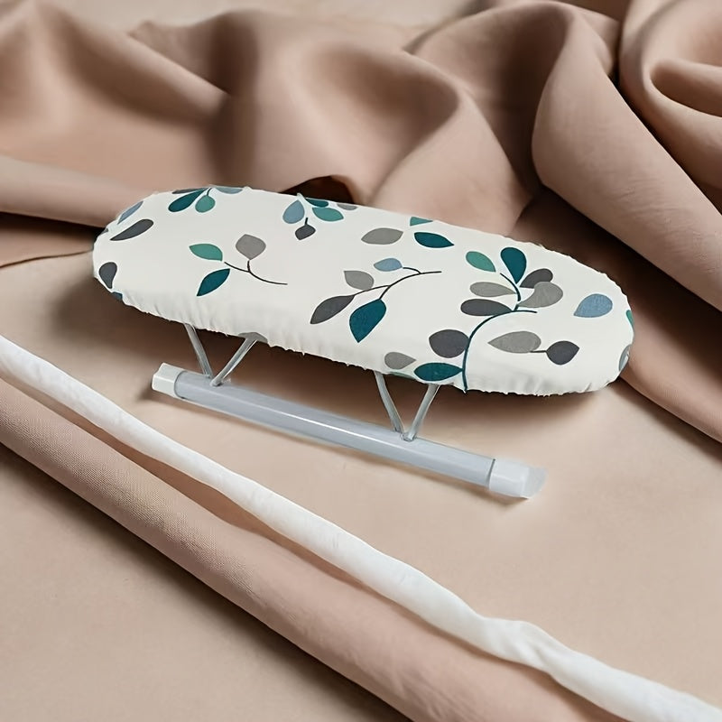 Portable mini ironing board featuring a leaf pattern, perfect for ironing sleeves and collars. Lightweight and easy to transport, no electricity or batteries needed.