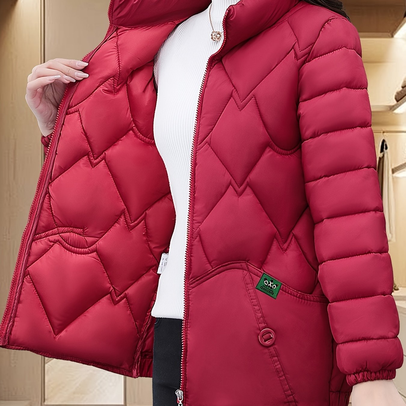 Embroidered quilted jacket for middle-aged moms with pleated hem and thick insulation for warmth.