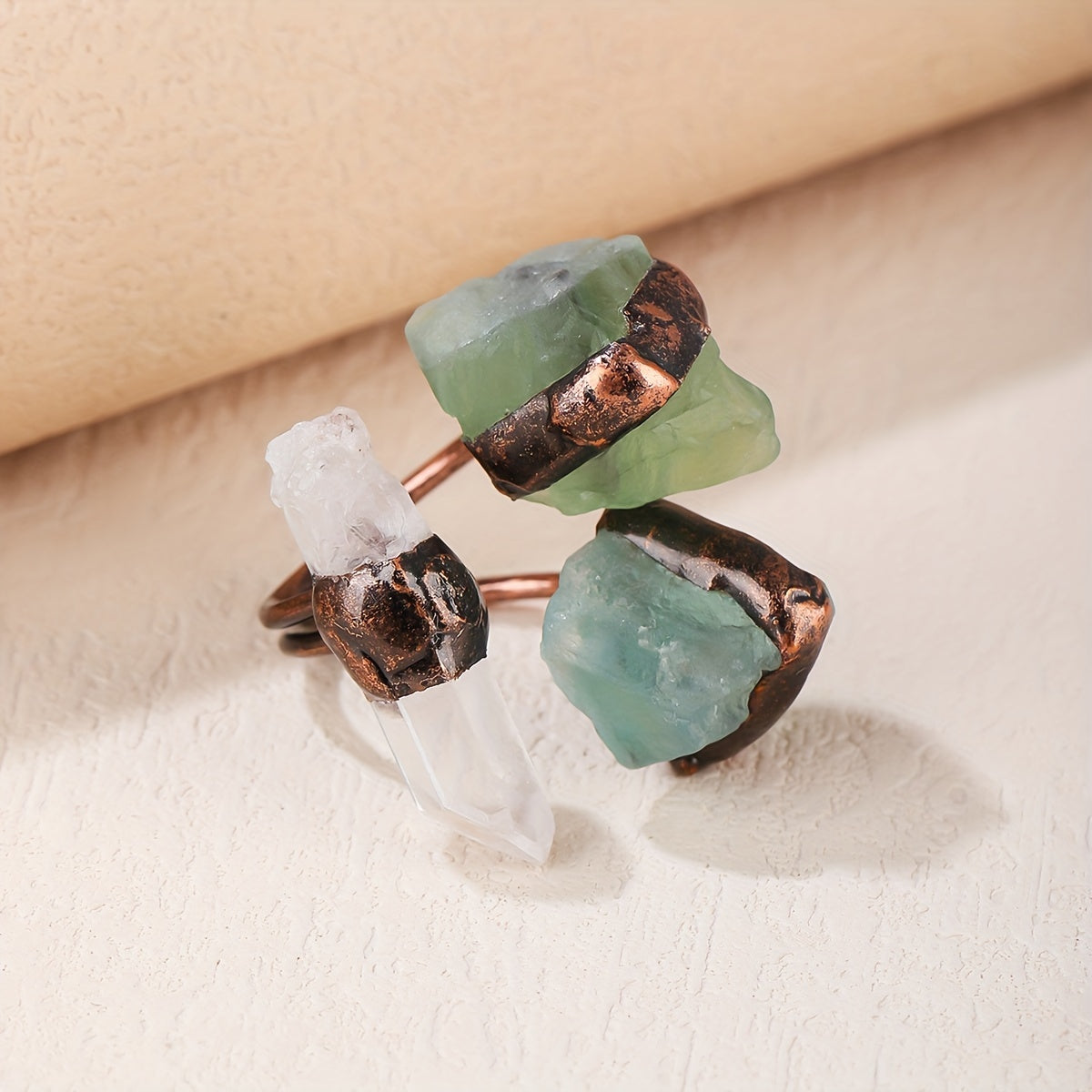 Handmade from natural crystals, this one-of-a-kind ring showcases a beautiful mix of light and dark colors, random shapes, and unique fluff and sand cracks. These characteristics are not flaws, but rather natural phenomena that make each piece truly