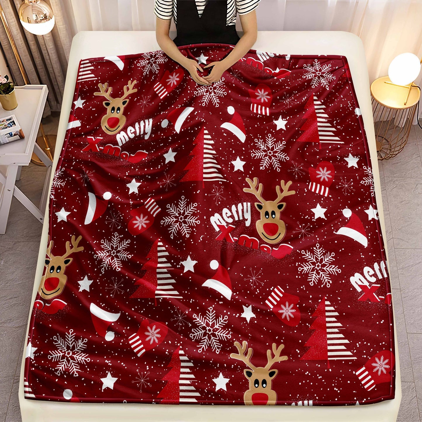 Get into the holiday spirit with this cozy Christmas blanket featuring a festive reindeer and snowflake design. Made from soft and warm flannel, this throw is perfect for snuggling up on the sofa or bed. It also makes a great holiday gift and is machine