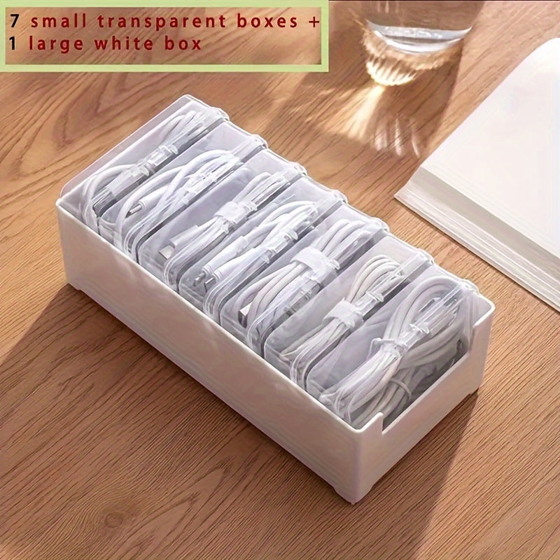 Get organized with 1 large white box and 7 small transparent boxes for cables and chargers.