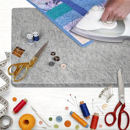 This portable wool pressing mat is perfect for quilting and sewing. It measures 25.4x0.0cm / 34.29x34.29cm and is made of felt for ironing. No power is needed, making it ideal for craft supplies.