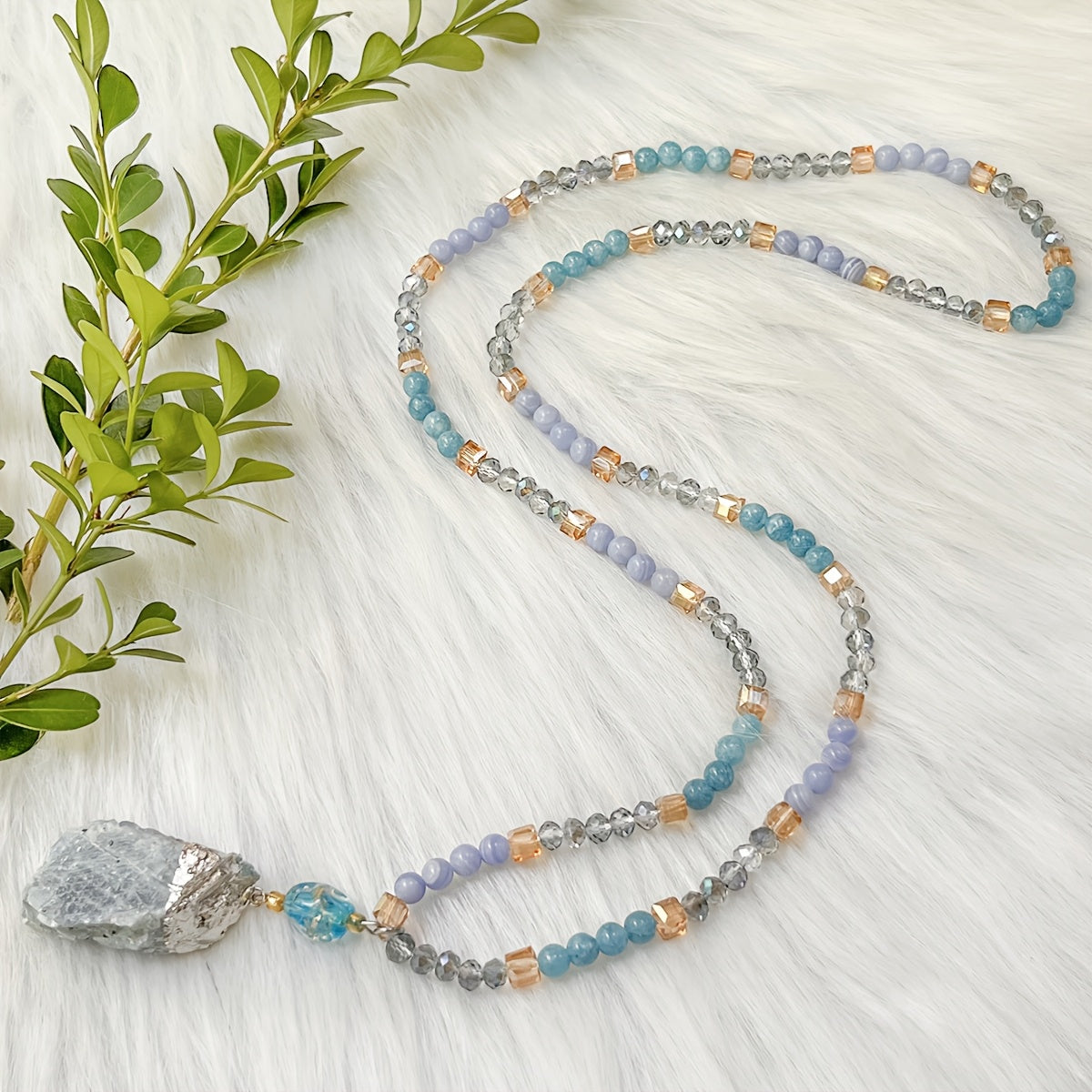 Unique vintage-inspired mala necklace featuring a raw kyanite pendant, beautiful blue lace agate and amazonite beads. Hand-beaded with love, this crystal japamala promotes chakra mindfulness and inner peace. This elegant boho accessory is perfect for any