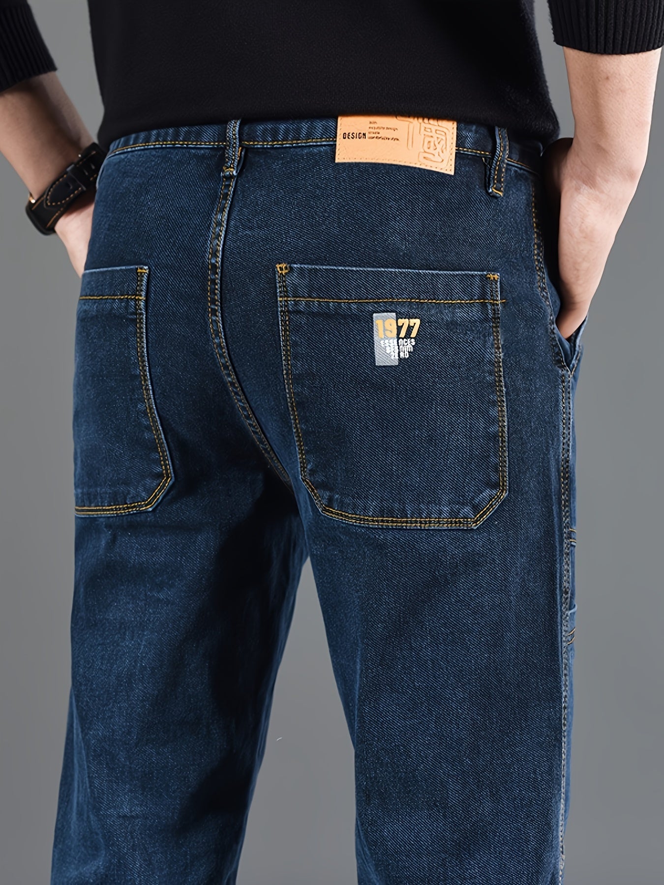 Men's regular fit denim jeans made of 70% cotton, 28% polyester, and 1.3% elastane with washed print, slight stretch, and 300g/m² woven fabric. Suitable for all seasons.