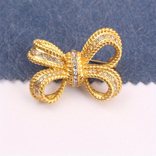 Chic Rhinestone Bow Brooch - Kiyim, sumkalar va shlyapalar uchun hashamatli va ko'p funksiyali aksessuar. Shaxsiy jozibani oshirish uchun rhinestone'lar bilan bezatilgan.