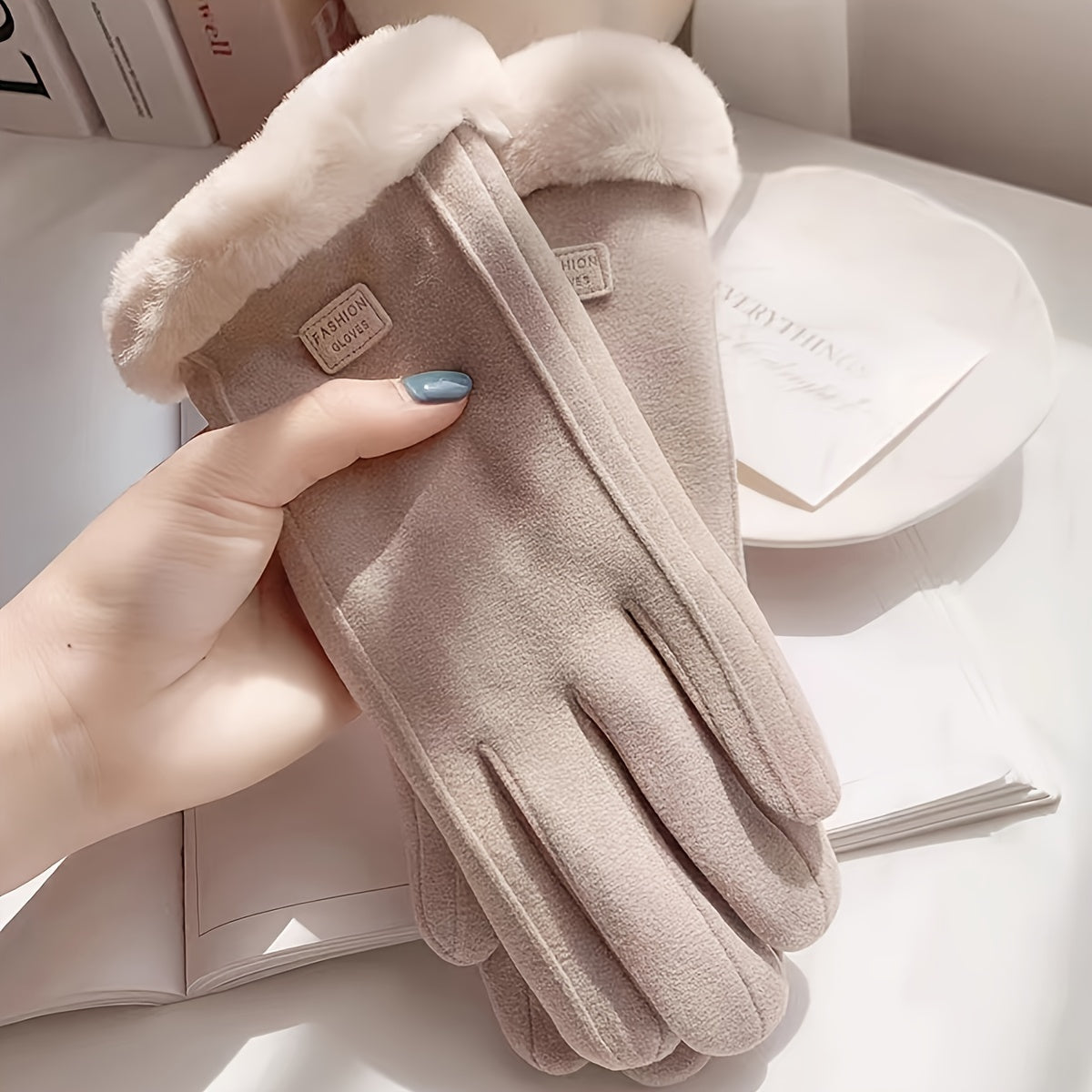 Warm and comfy beige touchscreen gloves for women with a plush lining to keep hands cozy in the winter featuring a full finger design.