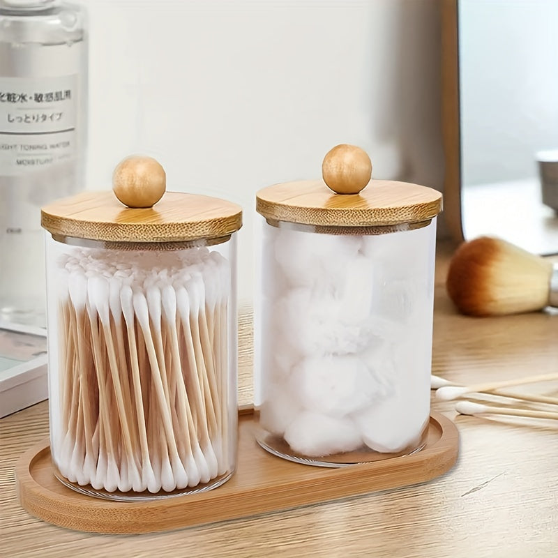 Holder dispenser set with bamboo lids and tray for bathroom storage including cotton swab, ball, pads, and floss.