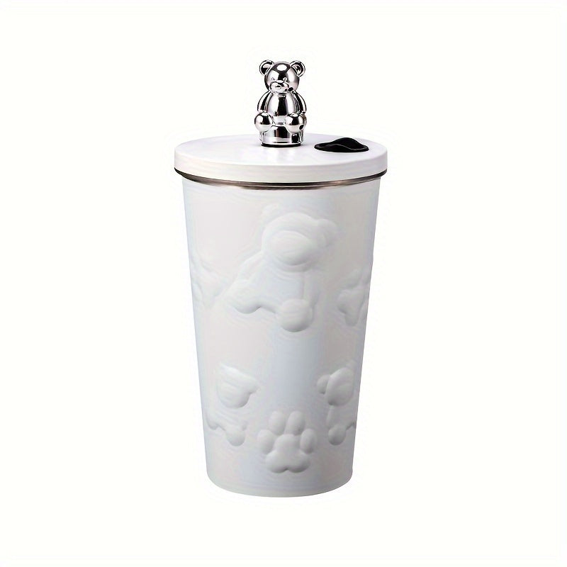 Stainless steel bear-themed coffee mug with straw for on-the-go use.