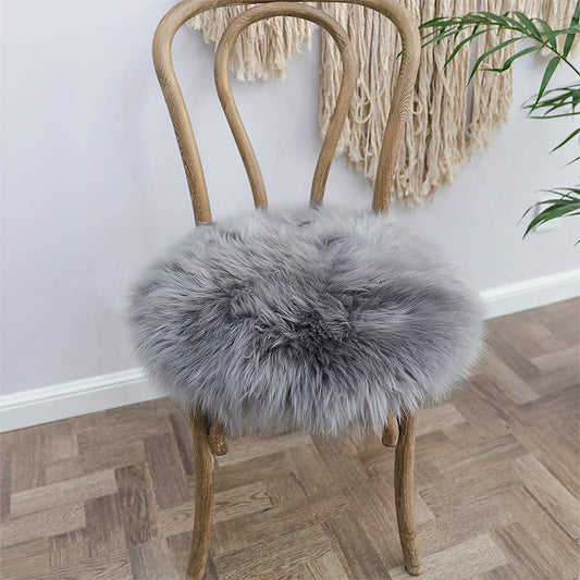 Soft and fluffy grey faux fur area rug and chair pad set. Perfect for adding a cozy touch to your living room. This set includes a small 12-inch round cover for seat cushions and carpet mats.