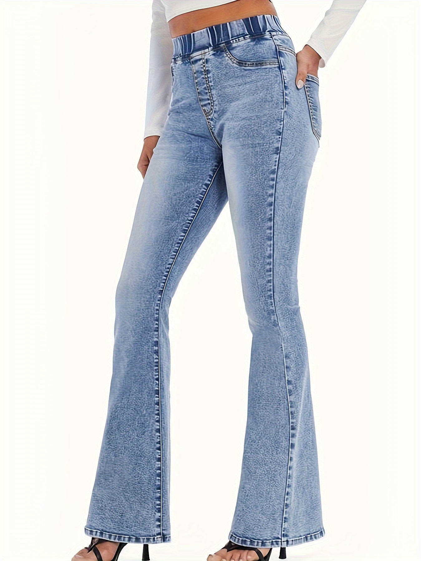 Women's high-waisted flare jeans in light wash blue, made of 65% cotton and 35% polyester blend. Features an elastic waistband, slant pockets, and smooth fabric. Suitable for casual or