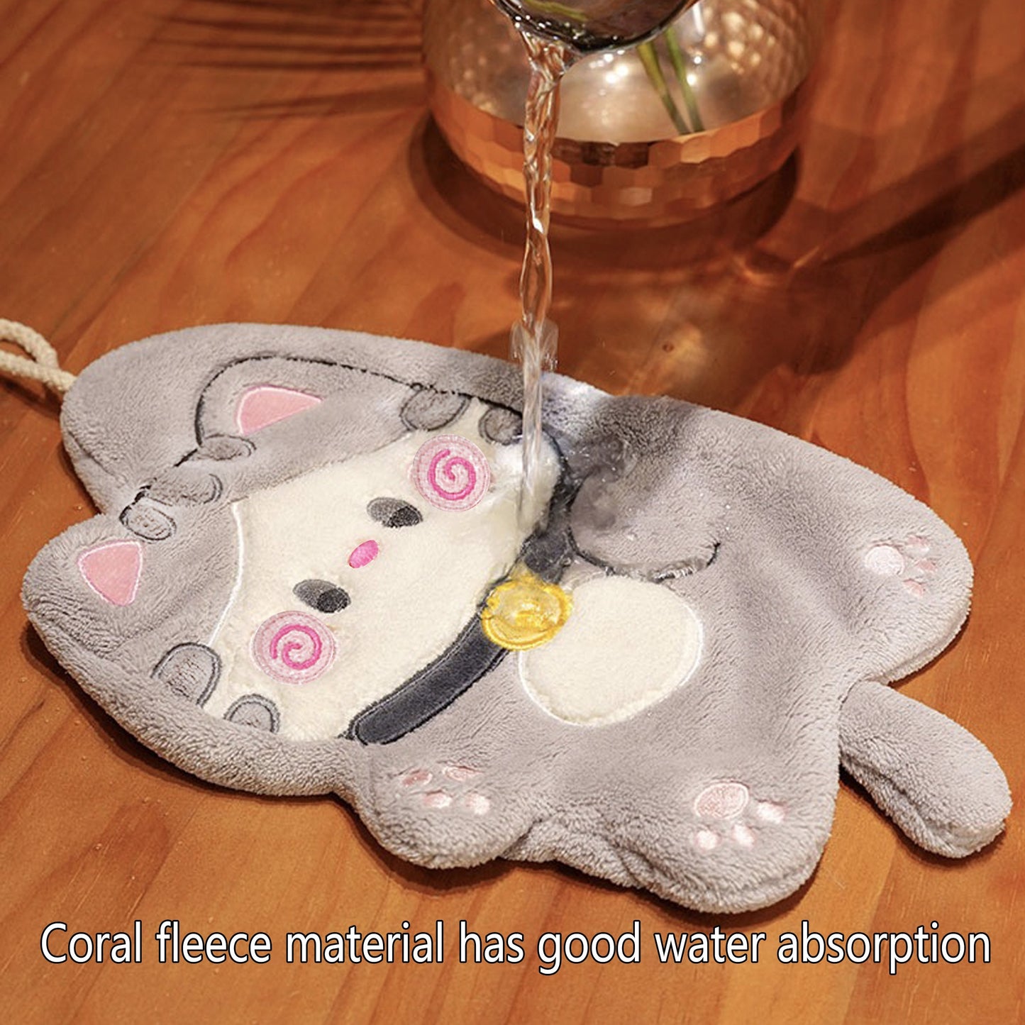 Adorable cat-shaped coral fleece hand towel in beige, white, and gray. Ultra absorbent and quick-drying with a hanging loop for kitchen, bathroom, and bedroom. Soft and skin-friendly contemporary design.