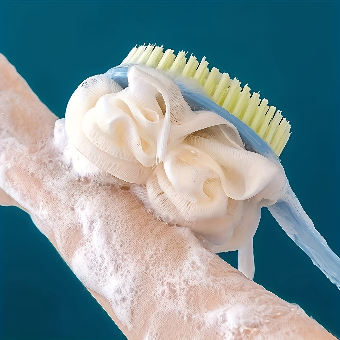 Long-handled back scrubber with soft bristles and bath ball for bathing.