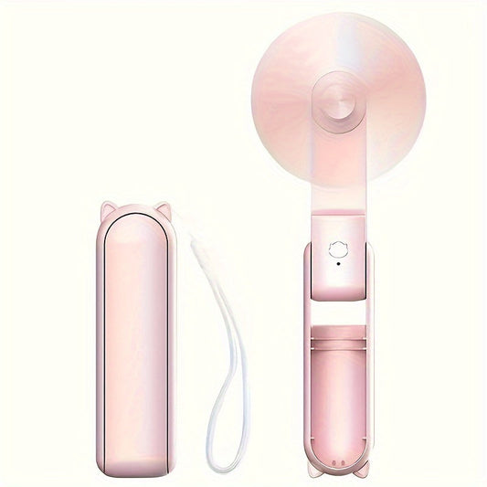 Compact handheld fan that is rechargeable via USB, with adjustable speed settings and a foldable design, perfect for women on the go during travel or outdoor activities.