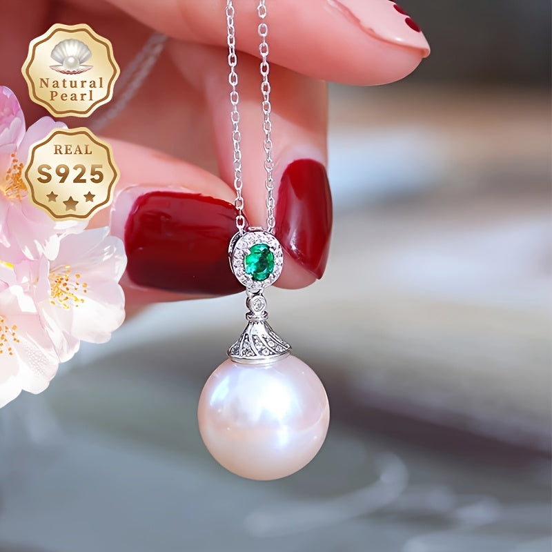 Give your loved one a special treat with this must-have gift box containing a stunning S925 silver pendant necklace featuring a 13-14mm round natural freshwater pearl. Each necklace is unique, with variations in natural pearls, shapes, and colors. The