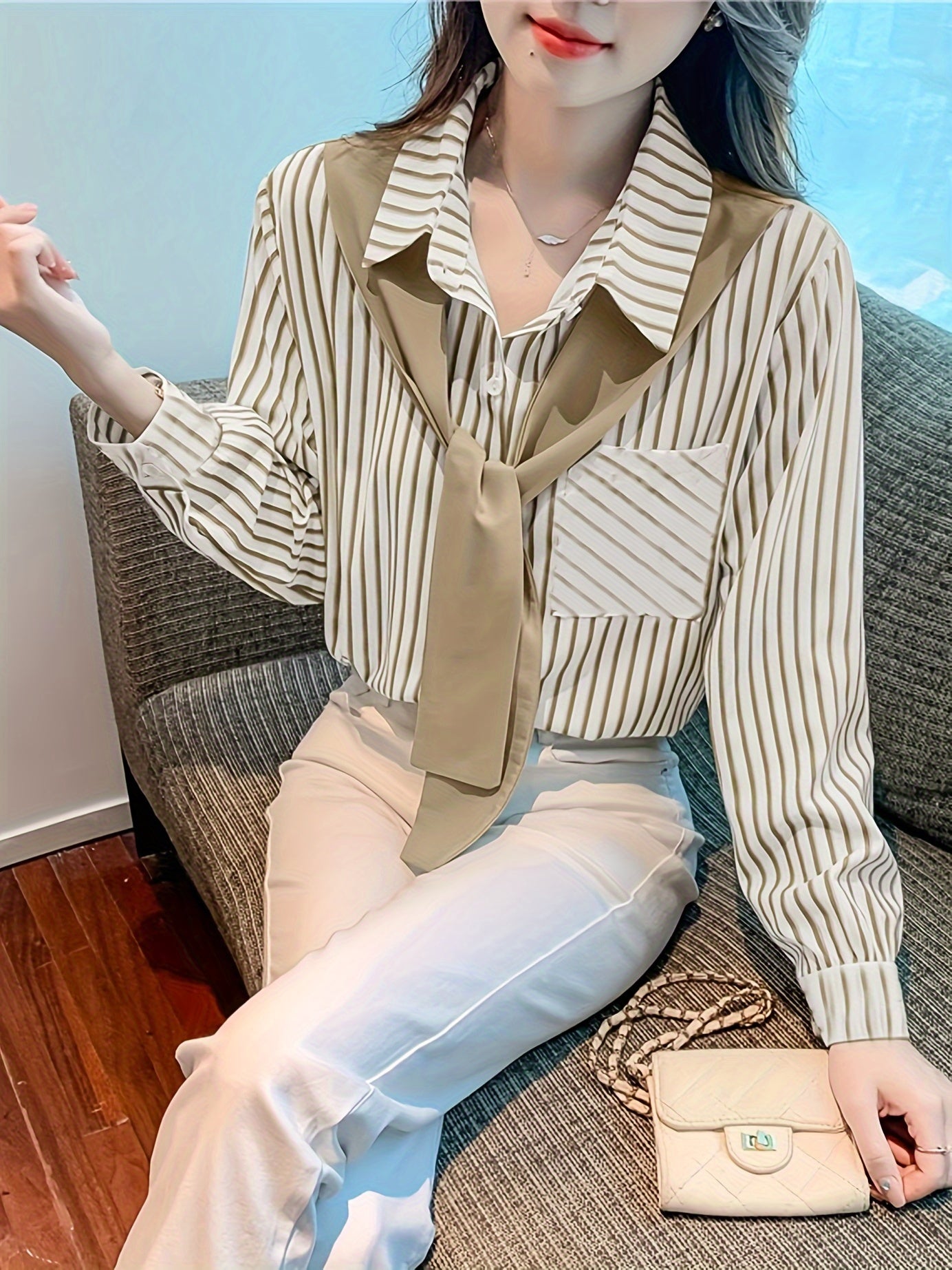 Elegant striped lace-up shirt with long sleeves and single breasted placket made of polyester, perfect for adults in spring/fall. Features a square neck.