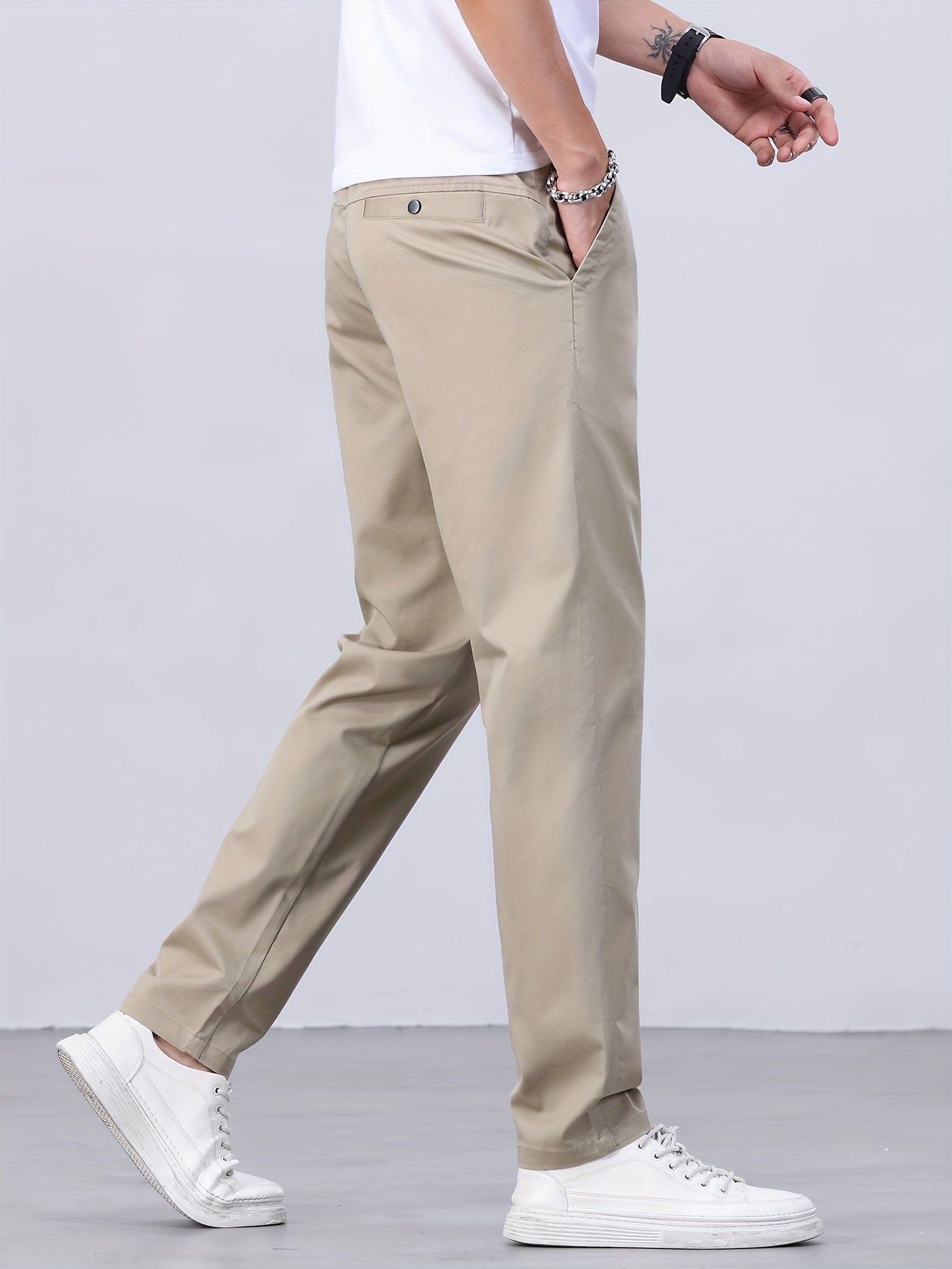 1 Men's all-season casual pants in caramel color, made of cotton blend with slight stretch and regular fit, featuring mid waist, pockets, zipper fly, and woven work style for weekend casual.