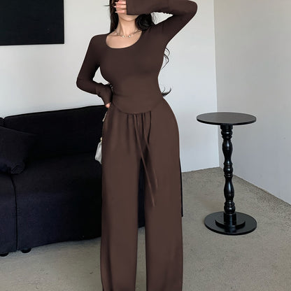 Women's Fall/Winter Polyester Crew Neck Top with Loose-Fit Pants and Pockets in Solid Color Knit Fabric Home Set.