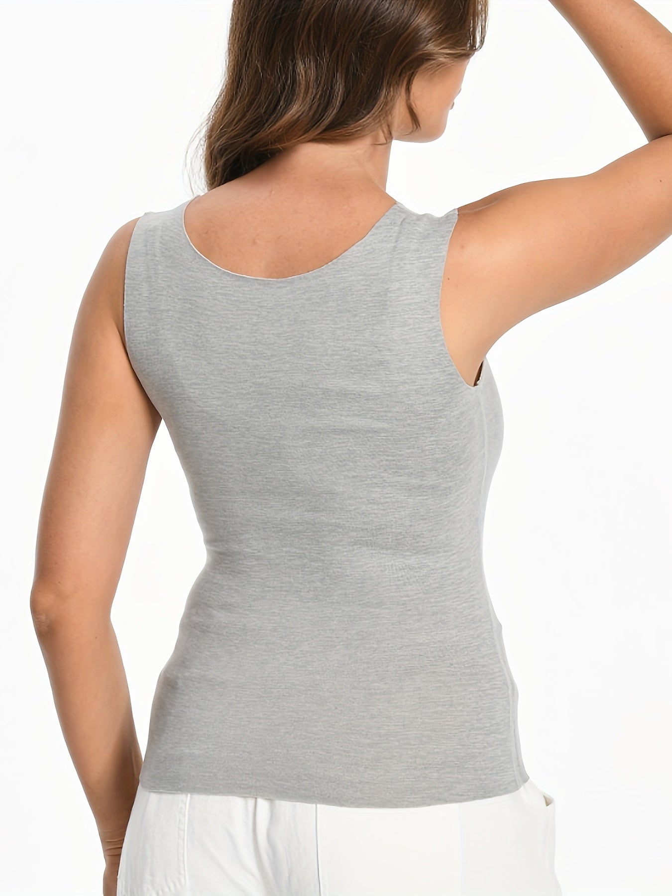 3 pieces of plush-lined thermal underwear with a warm, sleeveless tank top.