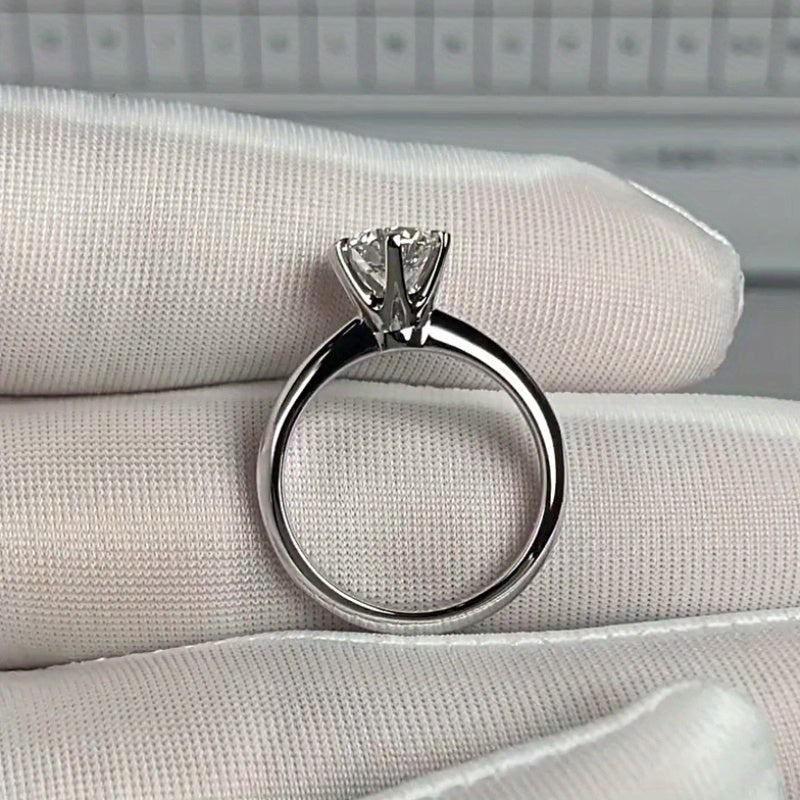 A stunning 925 silver ring with a 0.5 carat Moissanite stone in a six-prong setting. Perfect for both everyday wear and special occasions like engagements and weddings.