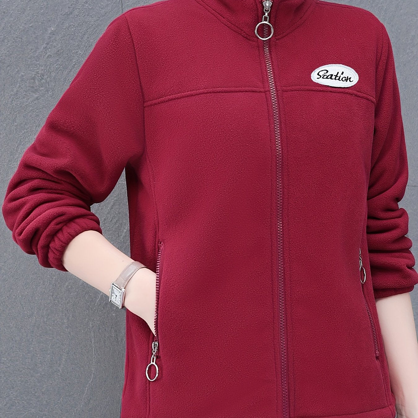 Women's casual fleece jacket with alphabet pattern, stand collar, long sleeves, regular fit, oversized, and zipper detail.