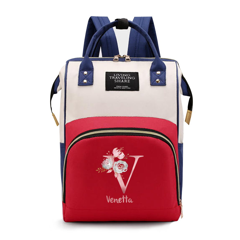 Personalized Mommy Backpack made of durable Oxford cloth with ample storage space for diapers and other essentials. Features customizable initials and name, as well as convenient bottle pockets. Perfect for nursing mothers on-the-go, with options for A-Z