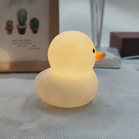 Duck-shaped LED night light, cute and fashionable, battery-powered with glossy finish. Perfect for bedroom decor and gift-giving for holidays, birthdays, or Christmas.