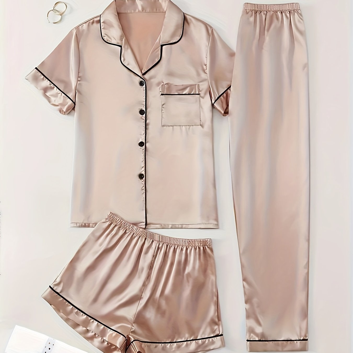 3-piece summer satin pajama set for women featuring collared shirt, long pants, and shorts. Made of 95% polyester and 5% elastane. Available in sizes S-XL.