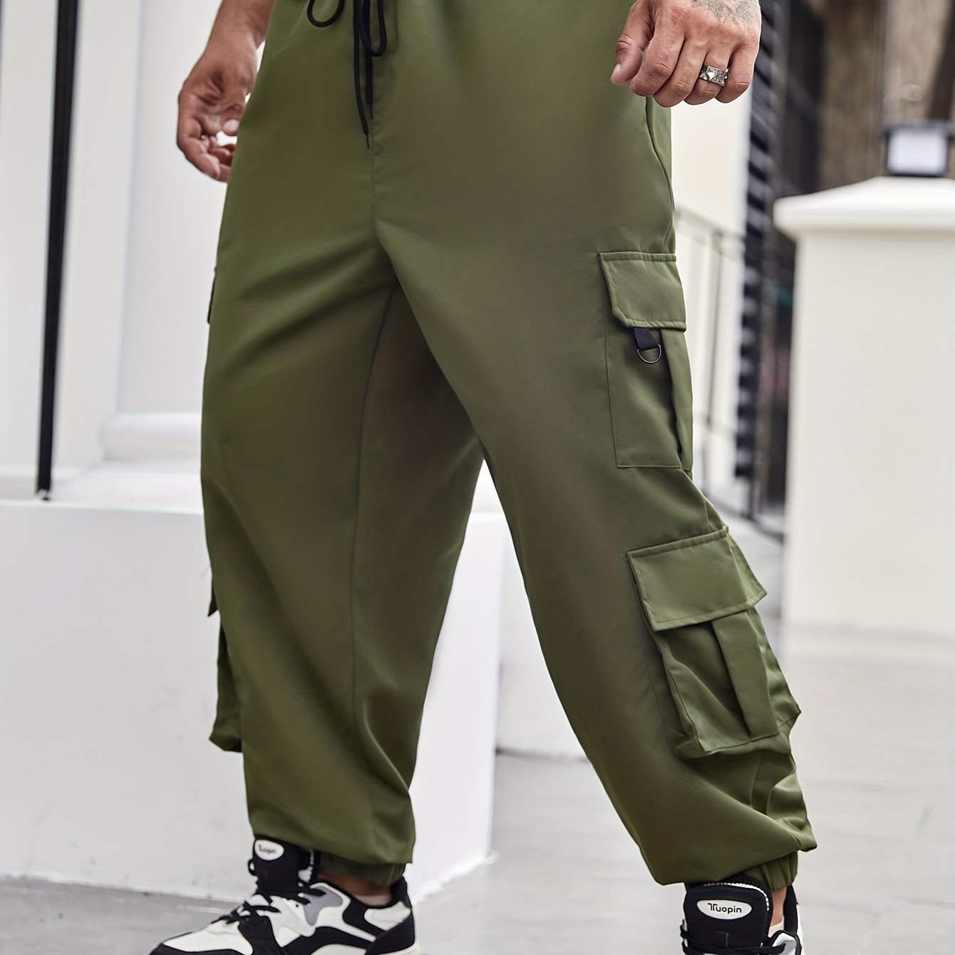 Men's plus size cargo pants with pockets for spring and fall fashion.