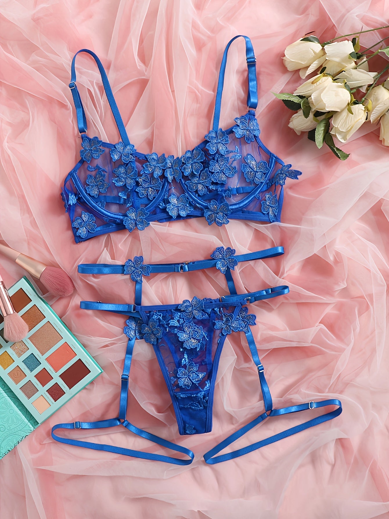 Floral embroidered mesh lingerie set with underwire, hollow-out bra, thong, and garter belts. Sexy and semi-sheer for women.