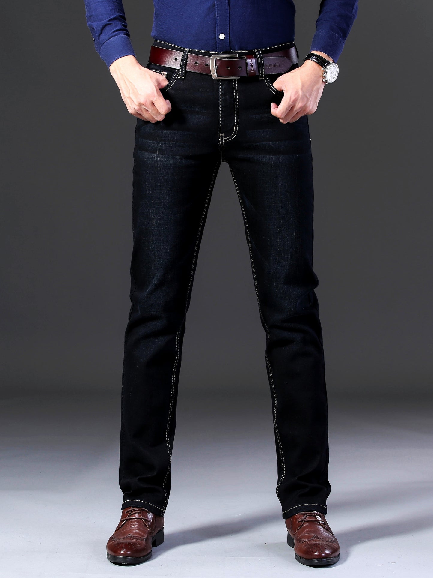 Men's solid denim trousers with pockets, casual cotton blend jeans for outdoor activities.