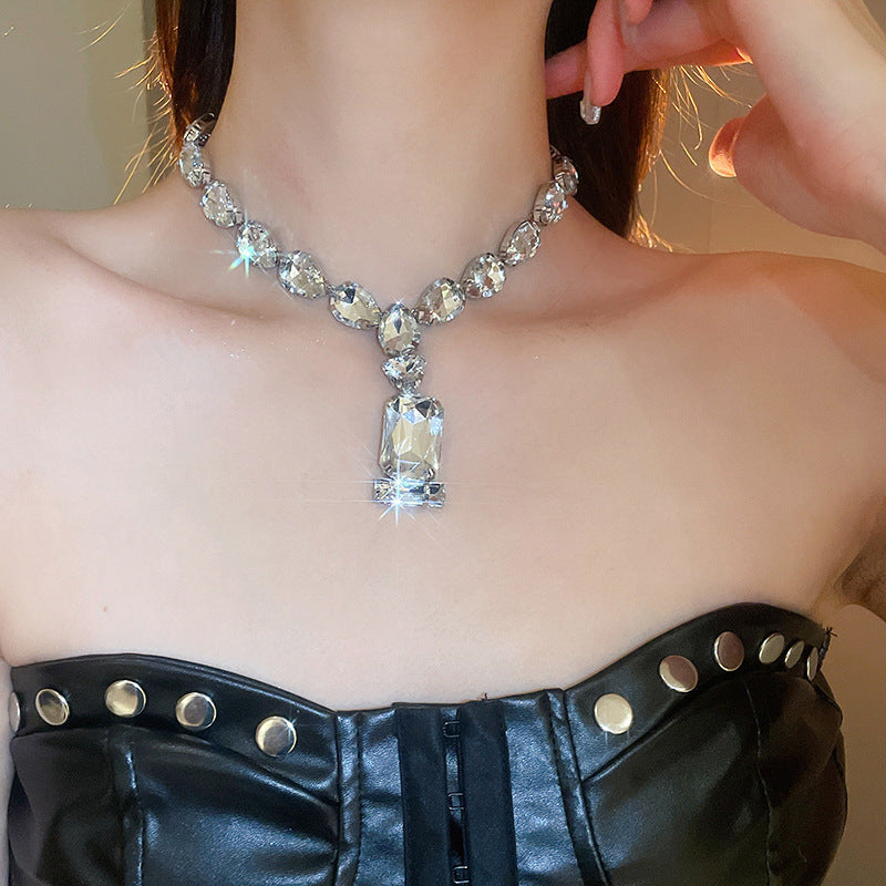 Stunning pendant necklace featuring a blend of Japanese and Korean styles, adorned with rhinestones. This iron jewelry showcases a unique rectangular and teardrop crystal design, perfect for adding a touch of elegance to parties and music festivals. A