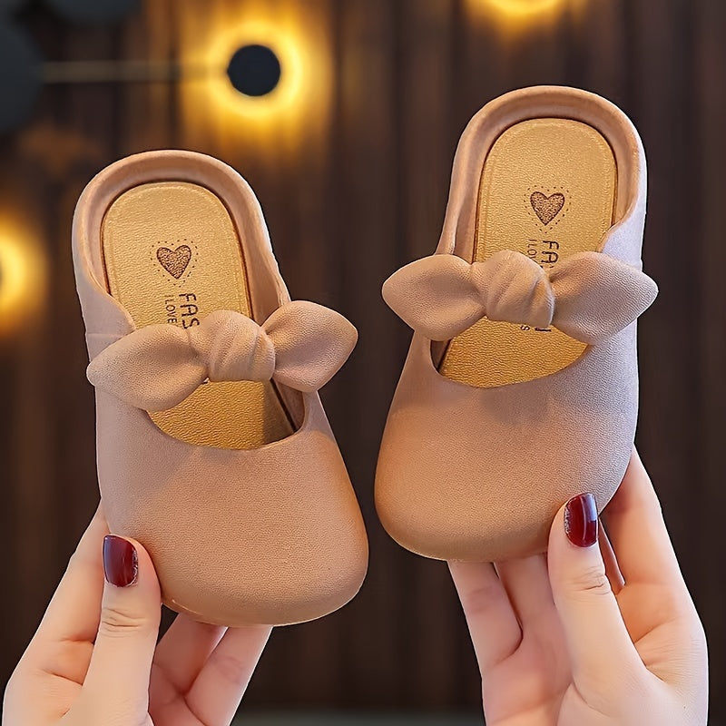 Stylish bowknot slip-on sandals for girls, perfect for indoor and outdoor wear.