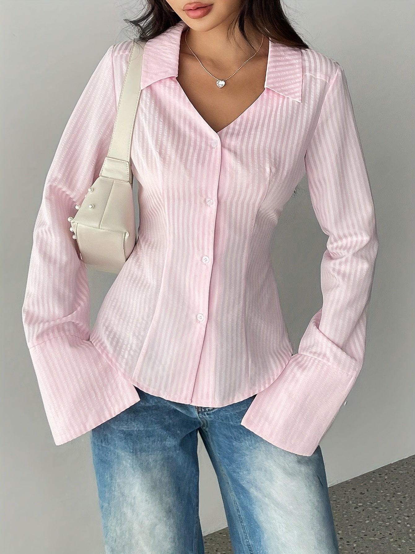 Women's V-neck striped button-up shirt with long sleeves made of woven polyester for spring/fall.