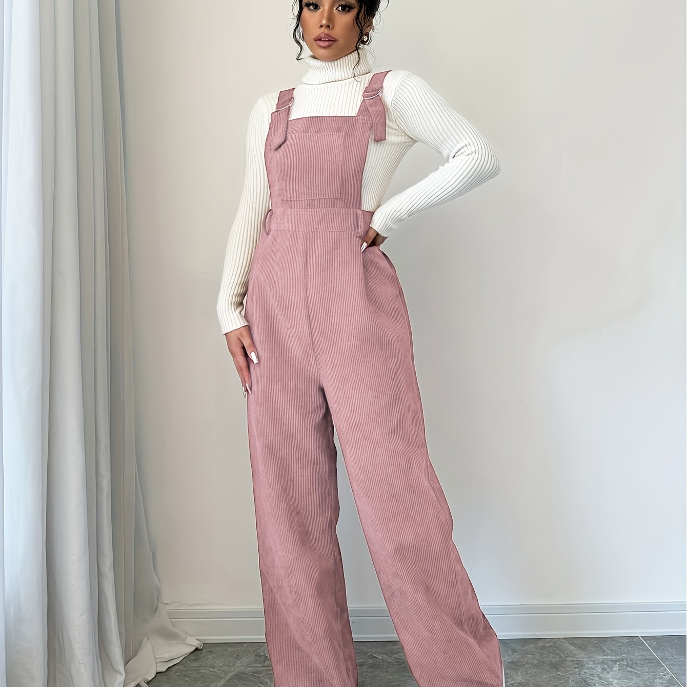 Spandex polyester jumpsuit for women with wide straps and button details, perfect for fall and winter.