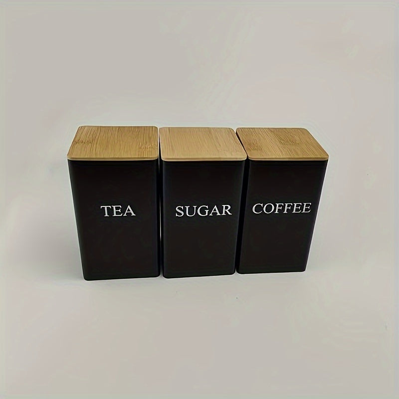 Set of 3 iron kitchen canisters with wooden lids. Washable, uncharged, engraved label storage containers for office and dining. White metal tea, coffee, sugar dispensers.