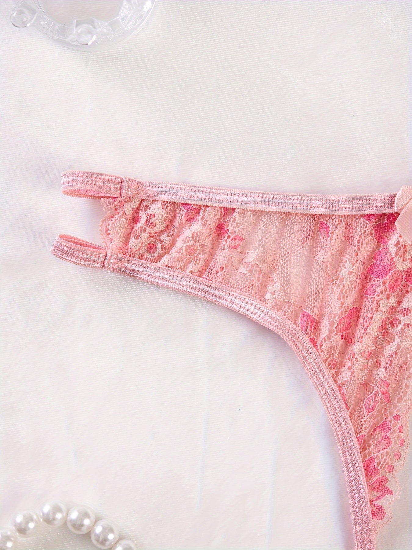 Stylish floral lace panties featuring bow detail, semi-sheer, comfortable fit for plus size women. Cute and fashionable.