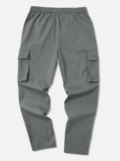 Men's cargo pants with multiple pockets and drawstring for outdoor activities.