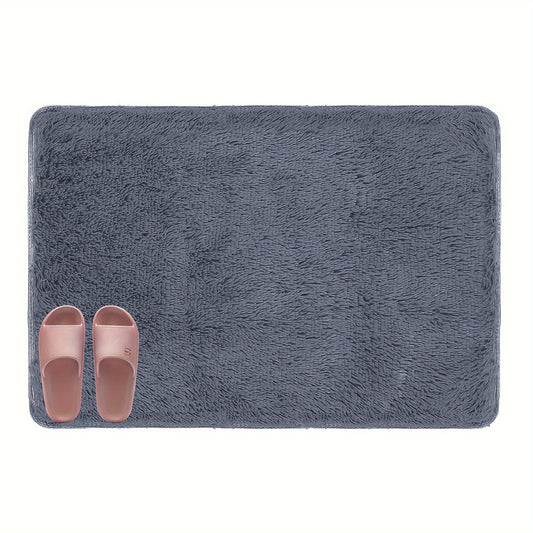 The Leorate Plush Solid Color Area Rug is a cozy bedside carpet perfect for any living room. Measuring 60.96cm x 88.9cm, this rug is made of machine washable polyester, making it easy to clean and maintain. Ideal for decorating for Christmas