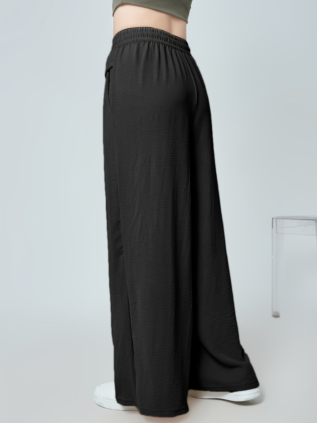 Stylish lounge bottoms with elastic drawstring, pleated detail, and wide leg fit for women's loungewear.