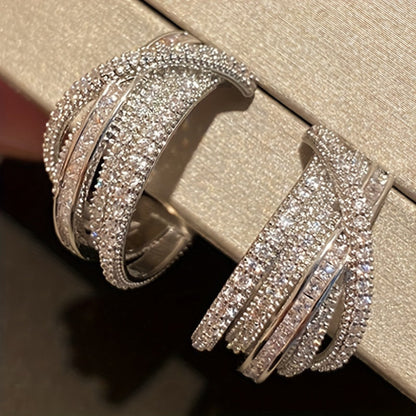 These stunning multi-layer earrings are adorned with intricate synthetic zirconia stones. The elegant C-shaped design makes them perfect for women to wear on their everyday outings, special occasions, or high-end events.