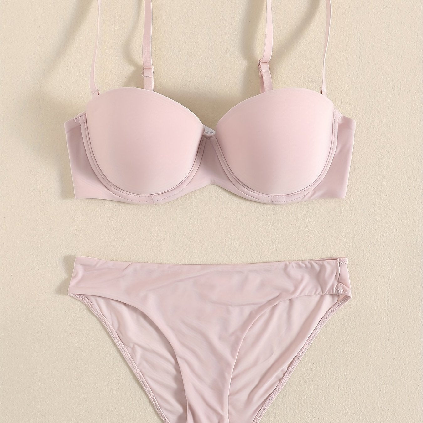 Smooth lingerie set including seamless bra, balconette bra, and bikini panties for women.