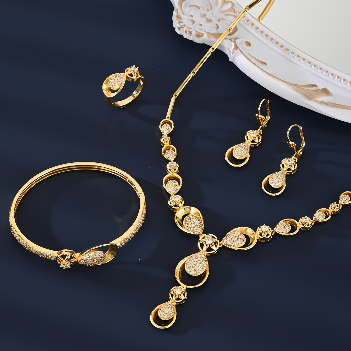 Exquisite 5-Piece Jewelry Set featuring 18K Gold Plating and Sparkling Zirconia Stones. This Set includes a Copper-Based Necklace, Earrings, Bracelet, and Ring perfect for Everyday Wear, Special Occasions, and as Gifts for Valentine's Day.