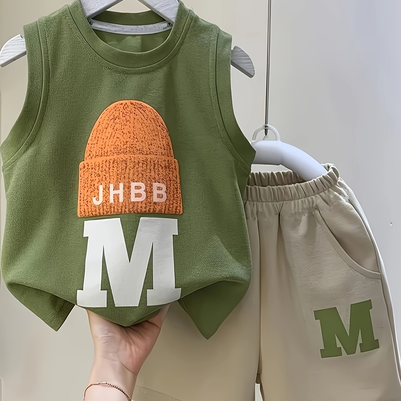 Baby boys 2-piece cotton set with sleeveless round neck vest, cap design, and shorts in green/beige. Perfect for summer wear.