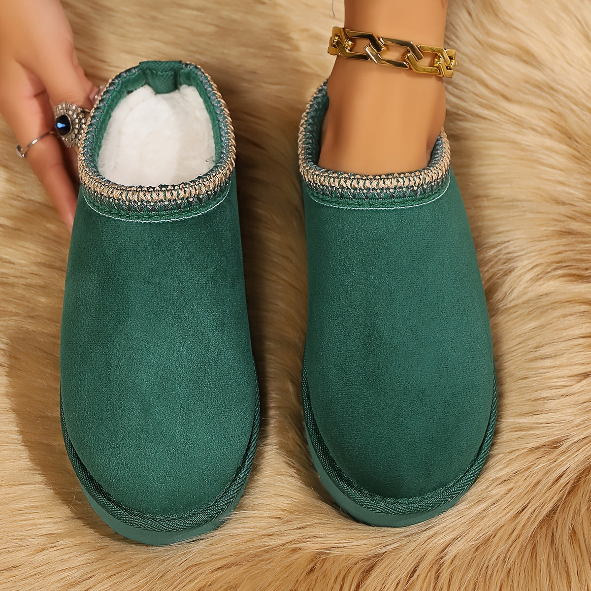 Warm and cozy women's winter slippers with plush lining and anti-slip sole.