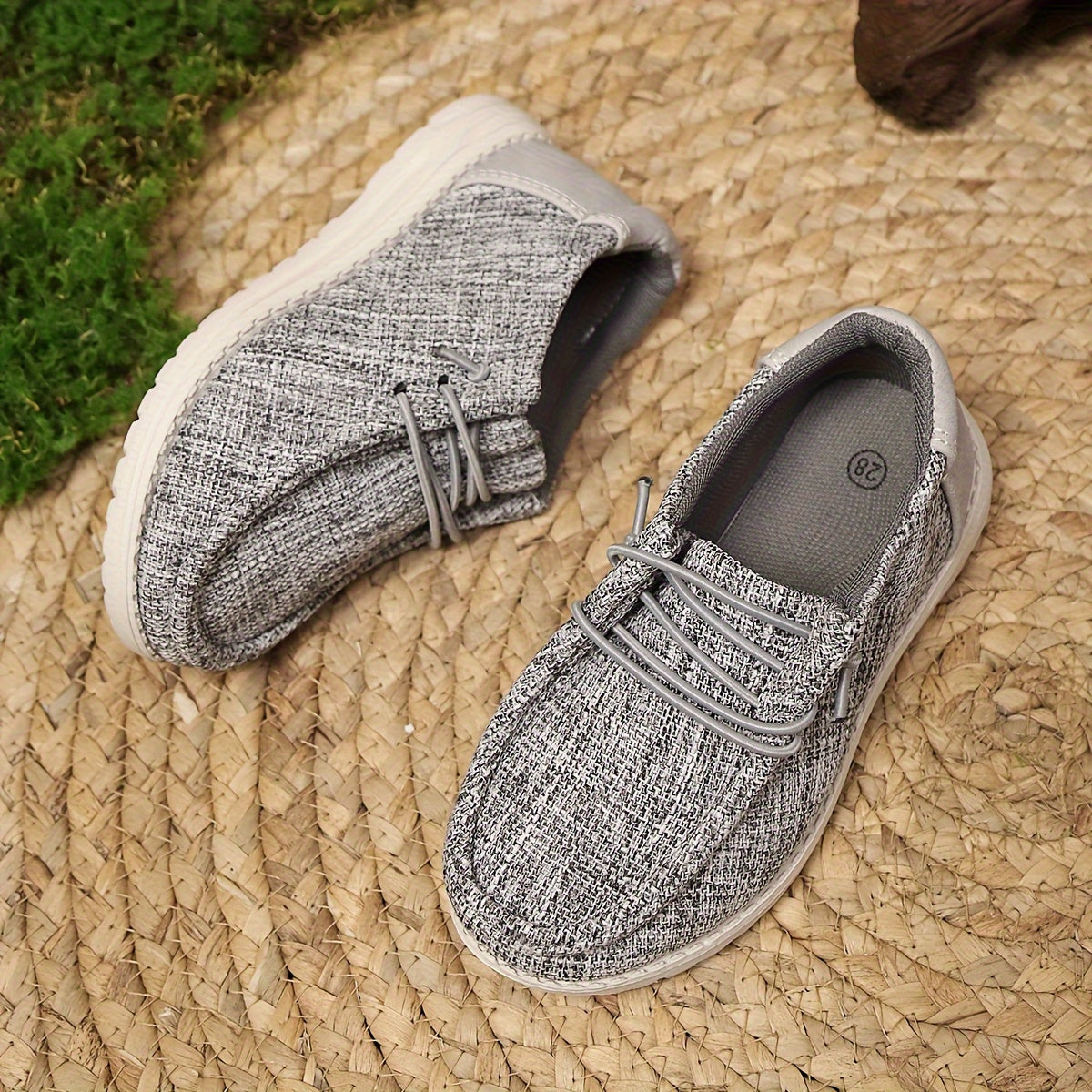 Breathable slip-on canvas sneakers with soft EVA sole and decorative stitching in gray fabric, ideal for all seasons and casual attire.