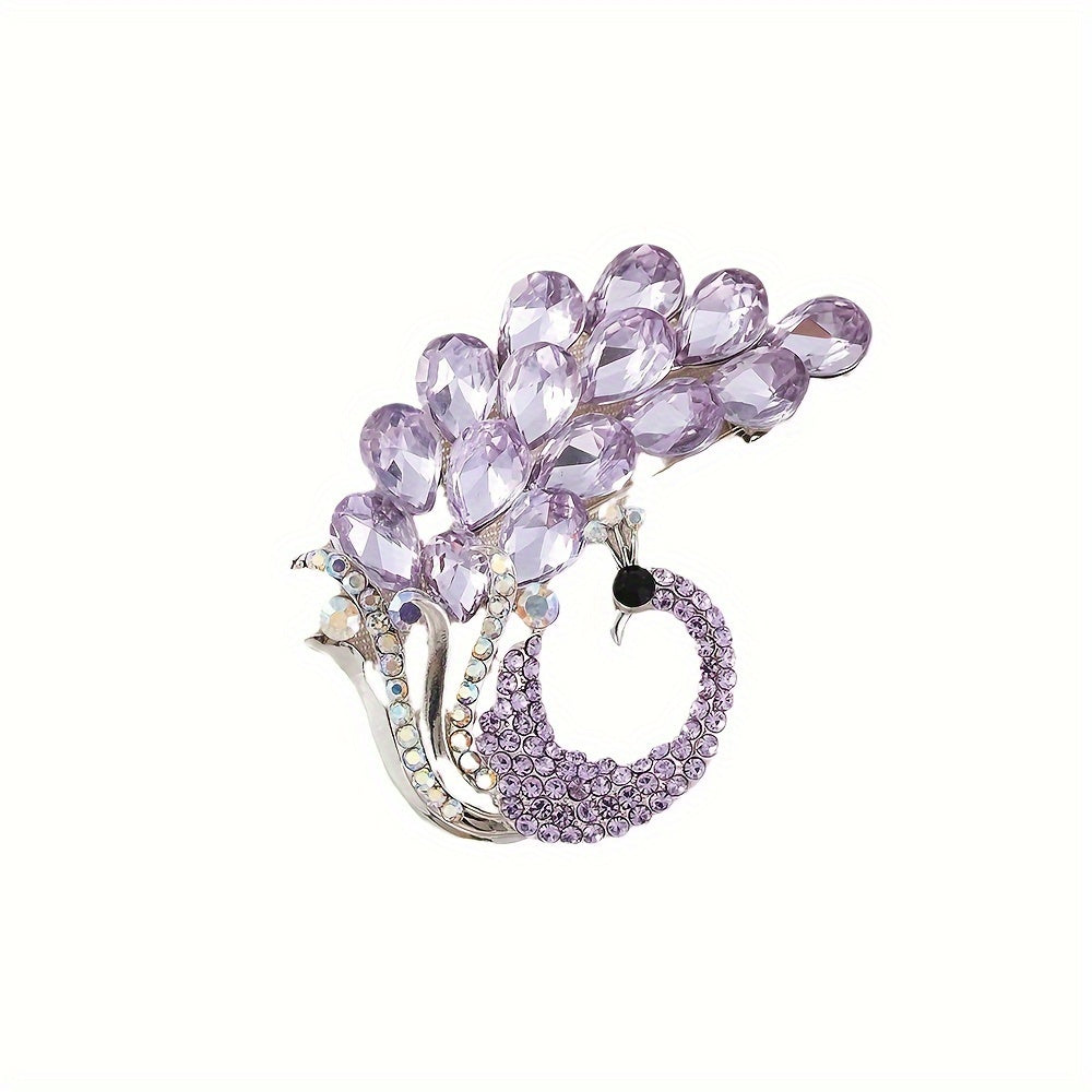 A beautiful purple crystal brooch pin, featuring an elegant and unique design with rhinestones. This fashion accessory is made from high-quality alloy material and showcases a stunning peacock design, perfect for women who appreciate stylish and